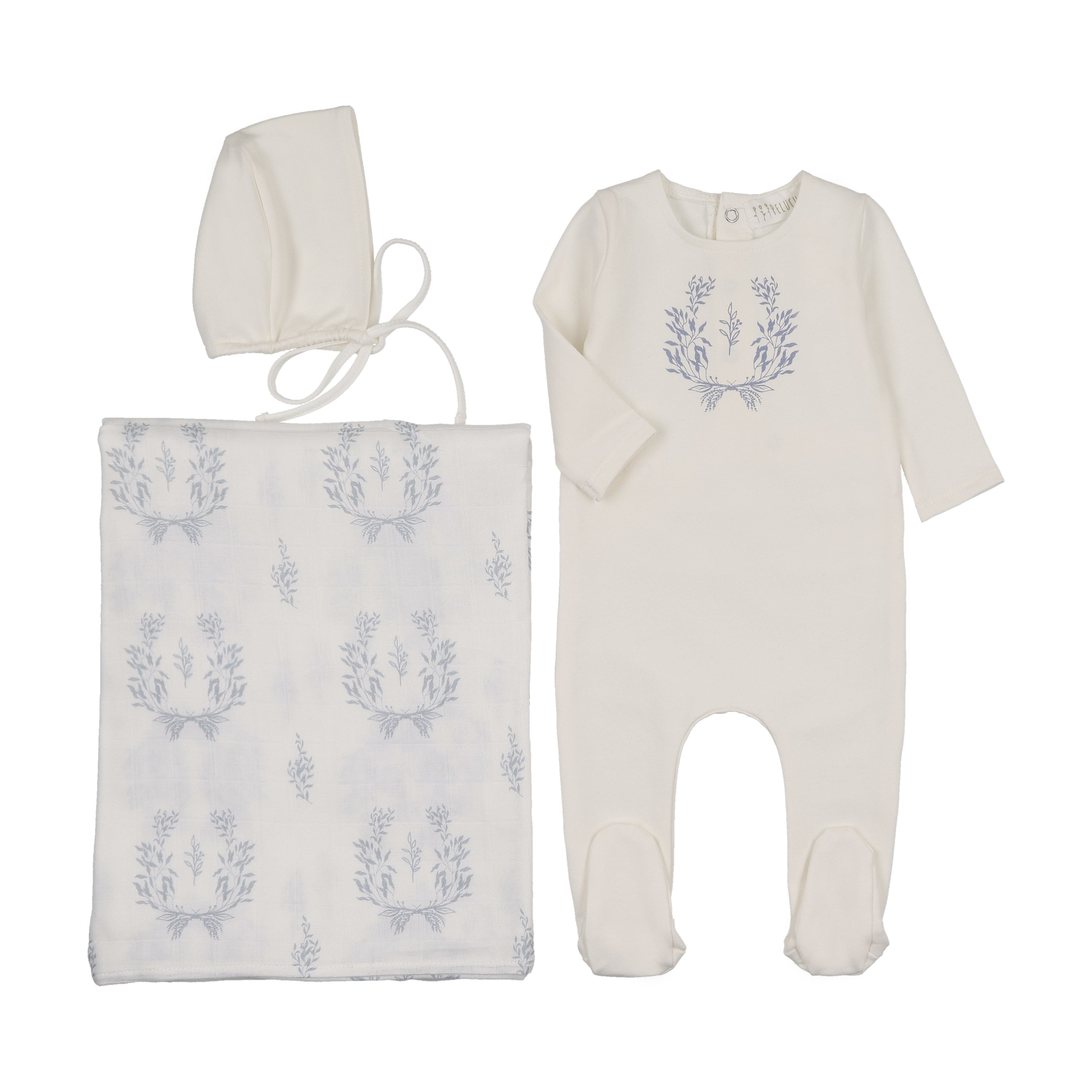 Baby outfit set with onesie, blanket, and bonnet featuring floral patterns on a white background.